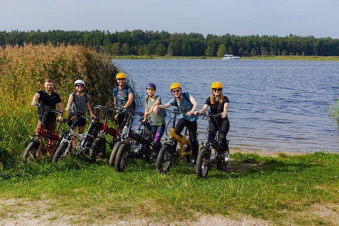 Guided Ebike Tour on Forest Roads and Trails Near Riga - Pine forest roads, sandy trails, and river views