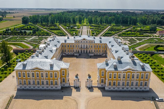 Private Full-Day Trip to Hill of Crosses, Rundale Palace & Bauska - Bauska Castle: walls, towers, and a river view